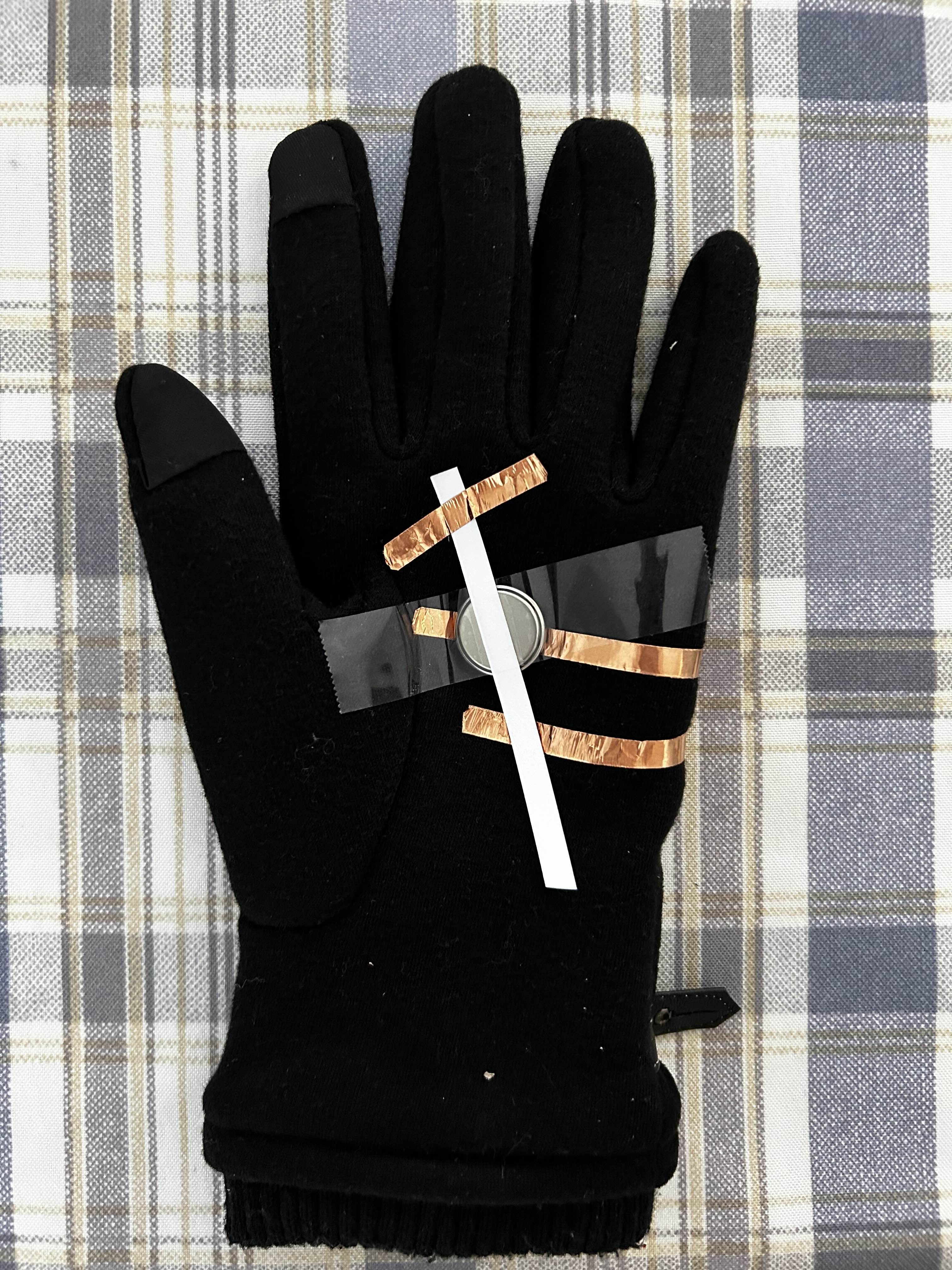 This is a wearable glove that lights up with you hit the switch with your other hand or someone else's hand. The video of it working is in the presentation doc.